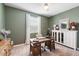 Bright home office features built-in shelving and a large window at 17040 W Echo Ln, Waddell, AZ 85355