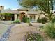 Single-story home with desert landscaping and a tile roof at 18510 E Leather Ln, Rio Verde, AZ 85263