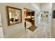 Hallway with mirror and view into home office at 18510 E Leather Ln, Rio Verde, AZ 85263