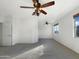 Large bedroom featuring two ceiling fans and ample natural light at 20326 N Donithan Way, Maricopa, AZ 85138