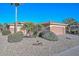 Tan house with palm trees and a gravel yard at 20888 N Canyon Whisper Dr, Surprise, AZ 85387