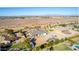 Aerial view of a single-story house with a large backyard and surrounding landscape at 21121 E Marsh Rd, Queen Creek, AZ 85142