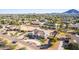 Aerial view of a house with a circular driveway and mountain views in the background at 21121 E Marsh Rd, Queen Creek, AZ 85142