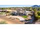 Stunning aerial view of a large house with circular driveway, landscaping, and mountain views at 21121 E Marsh Rd, Queen Creek, AZ 85142