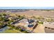 Aerial view of a single-story house with a large backyard and surrounding landscape at 21121 E Marsh Rd, Queen Creek, AZ 85142