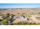 Aerial view of a house with a large backyard and RV parking, near a highway at 21121 E Marsh Rd, Queen Creek, AZ 85142