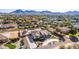Aerial view showcasing a house, expansive backyard, and surrounding neighborhood at 21121 E Marsh Rd, Queen Creek, AZ 85142