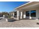 Spacious covered patio with stone accents and built-in planters at 21121 E Marsh Rd, Queen Creek, AZ 85142