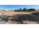 Open backyard with a gravel area and a white fence at 21121 E Marsh Rd, Queen Creek, AZ 85142