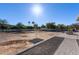 Large backyard with gravel pathway and space for landscaping at 21121 E Marsh Rd, Queen Creek, AZ 85142