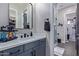 Modern bathroom with gray vanity, quartz countertop, and a walk-in shower at 21121 E Marsh Rd, Queen Creek, AZ 85142