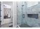 Bathroom with a walk-in shower and modern gray tile at 21121 E Marsh Rd, Queen Creek, AZ 85142