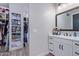 Bathroom with vanity, walk-in closet and modern fixtures at 21121 E Marsh Rd, Queen Creek, AZ 85142