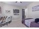 Bright bedroom with a bed, desk, and a view of another room at 21121 E Marsh Rd, Queen Creek, AZ 85142