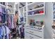 Large walk-in closet with custom shelving and drawers at 21121 E Marsh Rd, Queen Creek, AZ 85142