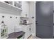 Organized drop zone with built-in bench and shelving at 21121 E Marsh Rd, Queen Creek, AZ 85142