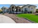 Modern farmhouse exterior with stone accents and landscaping at 21121 E Marsh Rd, Queen Creek, AZ 85142