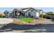 Modern farmhouse exterior with a curved driveway at 21121 E Marsh Rd, Queen Creek, AZ 85142