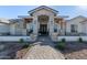 Stunning curb appeal with stone accents and a welcoming entryway at 21121 E Marsh Rd, Queen Creek, AZ 85142