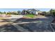 Home exterior showcasing a spacious driveway and landscaping at 21121 E Marsh Rd, Queen Creek, AZ 85142
