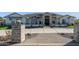 Modern farmhouse exterior with a large driveway at 21121 E Marsh Rd, Queen Creek, AZ 85142