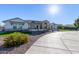 Home exterior showcasing a large driveway and landscaping at 21121 E Marsh Rd, Queen Creek, AZ 85142