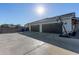 Three-car garage with basketball court and RV gate at 21121 E Marsh Rd, Queen Creek, AZ 85142