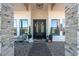 Elegant entryway with double doors and a charming sitting area at 21121 E Marsh Rd, Queen Creek, AZ 85142