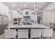 Modern kitchen with large island, stainless steel appliances, and white cabinetry at 21121 E Marsh Rd, Queen Creek, AZ 85142