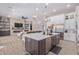 Modern kitchen with large island, stainless steel appliances, and white cabinetry at 21121 E Marsh Rd, Queen Creek, AZ 85142