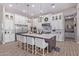 Modern kitchen with large island, stainless steel appliances, and white cabinetry at 21121 E Marsh Rd, Queen Creek, AZ 85142