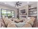 Open living space with a stone fireplace and built-in shelving at 21121 E Marsh Rd, Queen Creek, AZ 85142