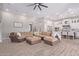 Open living area boasts a large sectional sofa and flows into the kitchen at 21121 E Marsh Rd, Queen Creek, AZ 85142