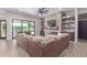 Open living space with a stone fireplace and built-in shelving at 21121 E Marsh Rd, Queen Creek, AZ 85142