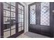 Office entry with glass French doors and hardwood floors at 21121 E Marsh Rd, Queen Creek, AZ 85142
