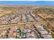 Aerial view of a luxury community with many homes and a mountain backdrop at 21354 W Minnezona Ave, Buckeye, AZ 85396