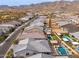 Aerial view showing the property's location within a residential neighborhood with pools and desert landscape at 21354 W Minnezona Ave, Buckeye, AZ 85396