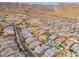 Aerial view of the property and surrounding neighborhood, mountains in background at 21354 W Minnezona Ave, Buckeye, AZ 85396