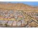 Aerial view of the property's location within a residential neighborhood, near mountains at 21354 W Minnezona Ave, Buckeye, AZ 85396