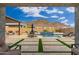 Spacious backyard with a pool, patio, and mountain views at 21354 W Minnezona Ave, Buckeye, AZ 85396