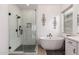 Spa-like bathroom with soaking tub, walk-in shower, and modern fixtures at 21354 W Minnezona Ave, Buckeye, AZ 85396