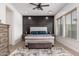 Main bedroom with dark accent wall and plush carpet at 21354 W Minnezona Ave, Buckeye, AZ 85396