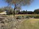 Community clubhouse with pond and landscaping at 21354 W Minnezona Ave, Buckeye, AZ 85396