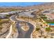 Community entrance with a landscaped roundabout and a gated entry at 21354 W Minnezona Ave, Buckeye, AZ 85396