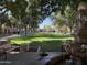 Landscaped park with fountain, benches, and mature trees in Verrado at 21354 W Minnezona Ave, Buckeye, AZ 85396
