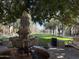 Ornate fountain in Verrado's community park with benches and trees at 21354 W Minnezona Ave, Buckeye, AZ 85396