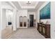 Elegant entryway with high ceilings and hardwood floors at 21354 W Minnezona Ave, Buckeye, AZ 85396