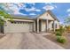 Modern farmhouse style home with a 2-car garage and desert landscaping at 21354 W Minnezona Ave, Buckeye, AZ 85396