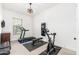 Home gym with treadmill, exercise bike, and weights at 21354 W Minnezona Ave, Buckeye, AZ 85396