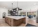 Open concept kitchen and dining area with an island and hardwood floors at 21354 W Minnezona Ave, Buckeye, AZ 85396
